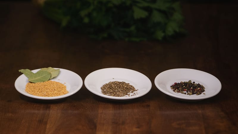 mustard seeds, dill seeds, peppercorn and a bay leaf